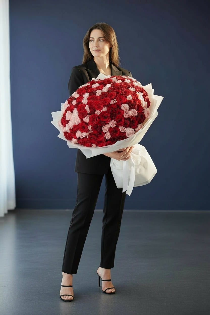 Luxury bouquet of 150 red and pink roses in white wrapping