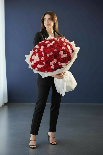 Luxury bouquet of 150 red and pink roses in white wrapping