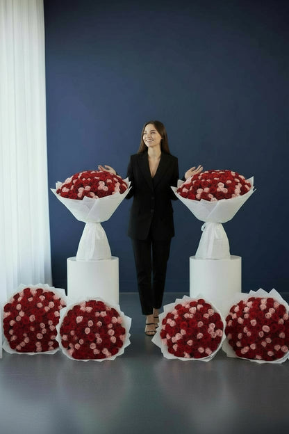 Luxury bouquet of 150 red and pink roses in white wrapping