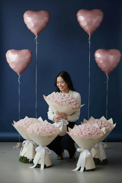 Pink room set with five 51 pink rose bouquets and four heart foil balloons