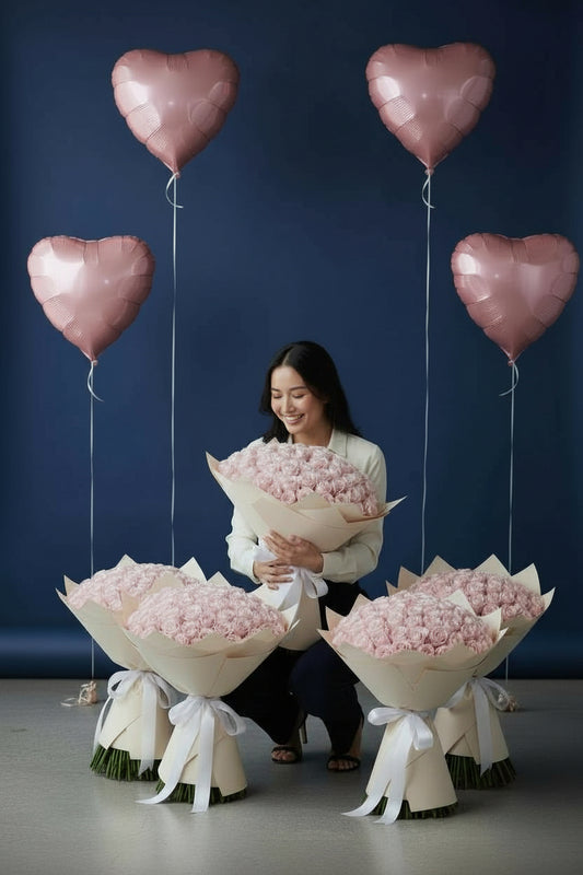 Pink room set with five 51 pink rose bouquets and four heart foil balloons