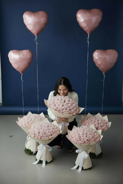 Pink room set with five 51 pink rose bouquets and four heart foil balloons