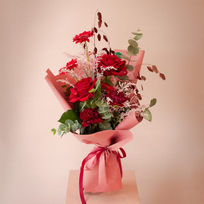 Red Roses Wrapped Bouquet Dubai – Elegant Hand-Tied Flowers | Bambi.ae - Bambi