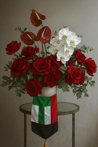 Vase with red roses, white orchids and red anthuriums for UAE National Day Gifting.