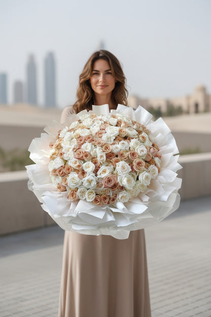 Woman holding a large bouquet of flowers outdoors