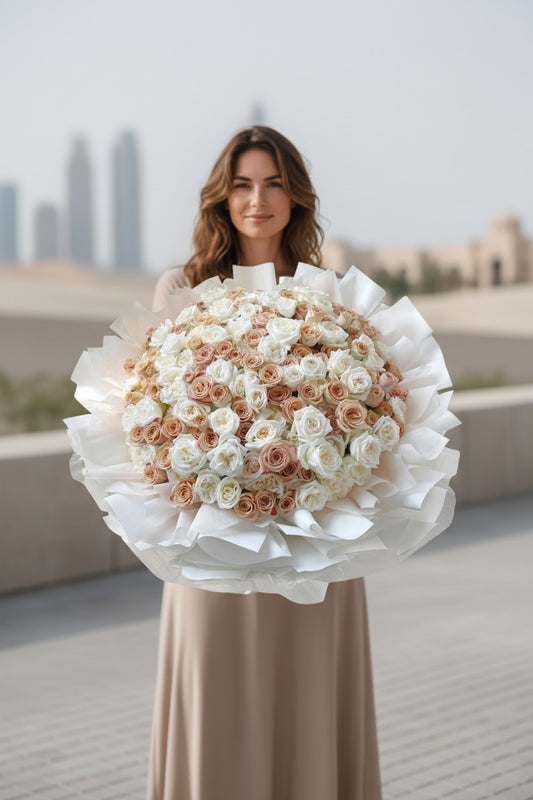 Woman holding a large bouquet of flowers outdoors